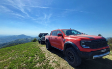 Load image into Gallery viewer, Ford Ranger RAPTOR (2022-2025) NEXT GEN (ANGLED) Phat Bars Rock Sliders/Side Steps – Powdercoated