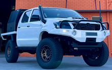 Load image into Gallery viewer, Toyota Hilux (2005-2015) N70 KUN (ANGLED) Phat Bars Rock Sliders/Side Steps – Powdercoated