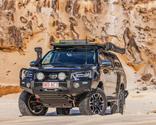 Load image into Gallery viewer, Toyota HiLux N80 (20-25) Ironman Deluxe Bull Bar &amp; Loom Kit
