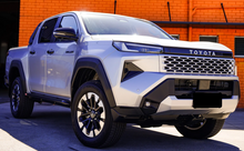 Load image into Gallery viewer, Toyota Hilux (2026-2028) N90 (ANGLED) Phat Bars Rock Sliders/Side Steps – Powdercoated
